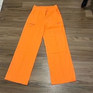 Orange wide leg pants with thigh slit